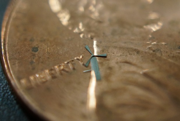 Image Caption: A micro-windmill is pictured on the face of a penny. Credit: 
UT Arlington 