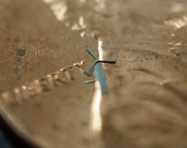 An actual micro-windmill from UT-Arlington, held against a penny