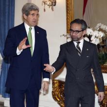 U.S. Secretary of State John Kerry, left, is ushered by Indonesian Foreign Minister Marty Natalegawa before a meeting at the Foreign Ministry office in Jakarta, Indonesia, Monday, Feb. 17, 2014. (AP Photo/Adi Weda, Pool)