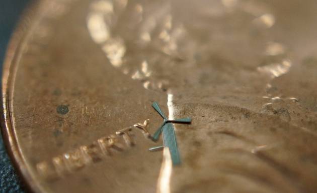 A photo showing a micro-windmill on a penny. Credit: UT Arlington