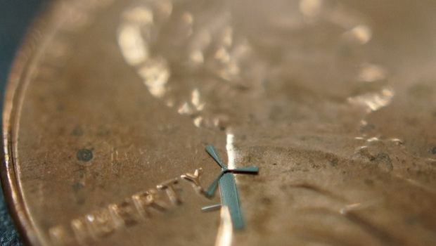 One of Rao's micro-windmills is placed here on a penny.Image Credit: University of Texas during Arlington